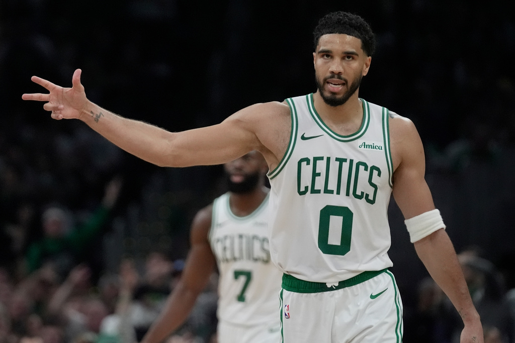 Boston Celtics forward Jayson Tatum (0) gestures after a teammate hit a 3-point basket during the second half in Game 1 of a first-round NBA playoffs basketball game against the Philadelphia 76ers, Sunday, April 19, 2026, in Boston. (AP Photo/Robert F. Bukaty)