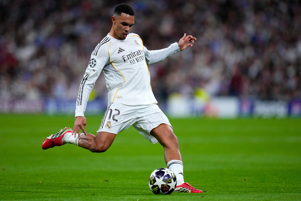 Real Madrid's Trent Alexander-Arnold kicks the ball during the second leg of the Champions League playoff soccer match between Real Madrid and Benfica in Madrid, Spain, Wednesday, Feb. 25, 2026. (AP Photo/Manu Fernandez)