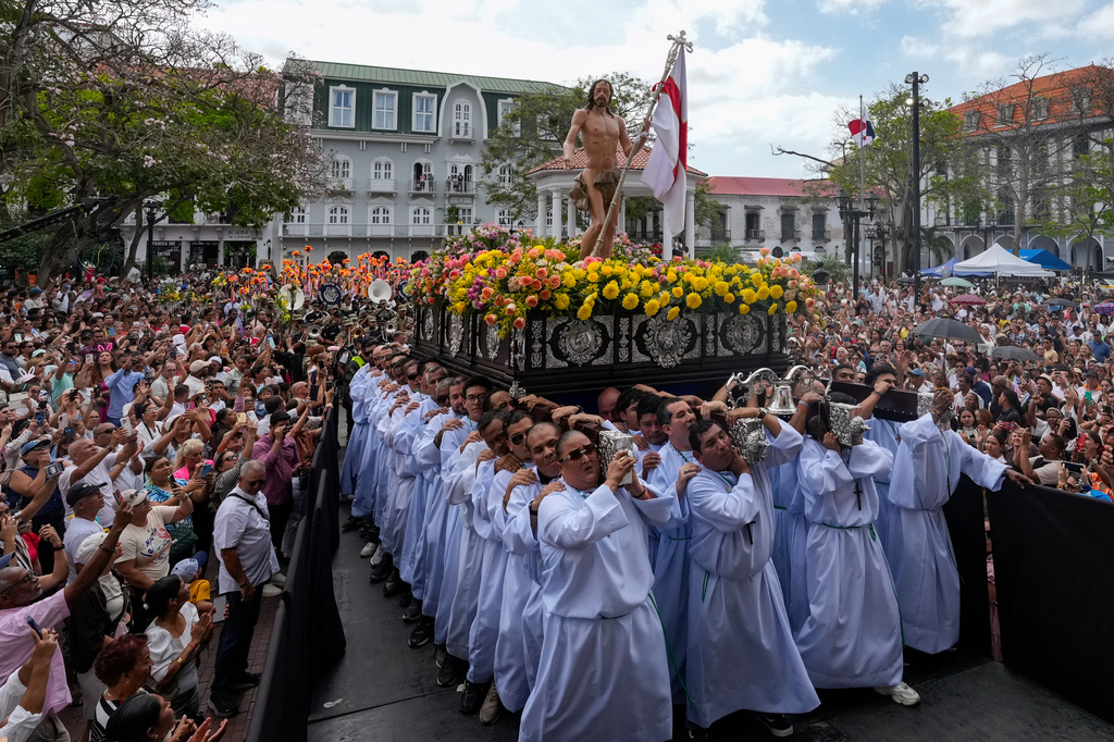Worshippers carry a figure of Jesus Christ during an Easter procession through Panama City's old town, Sunday, April 5, 2026. (AP Photo/Matias Delacroix)