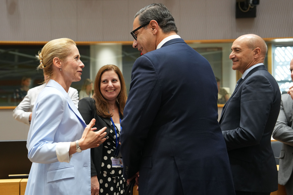 European Union foreign policy chief Kaja Kallas, left, speaks with Cypriot Foreign Minister Constantinos Kombos, center, during a round table meeting of EU foreign ministers in Brussels, Monday, July 13, 2026. (AP Photo/Marius Burgelman)