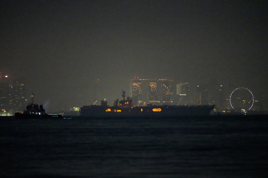 The U.S. Navy aircraft carrier USS Abraham Lincoln sails past Singapore as seen from Batam, Indonesia, Sunday, Aug. 30, 2026. (AP Photo/Dita Alangkara)