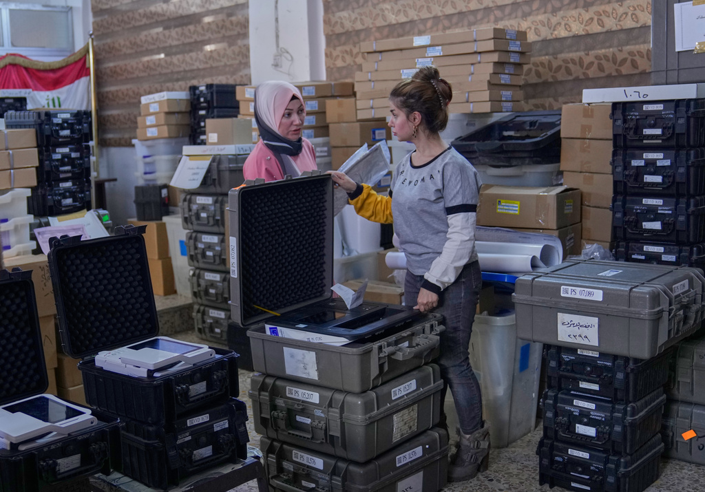 Workers from Iraq's electoral commission prepare voting materials, for the country's upcoming parliamentary elections on Nov. 11., at a polling station in Baghdad, Iraq, Thursday, Nov. 6, 2025. (AP Photo/Hadi Mizban)