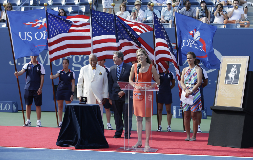 FILE - Monica Seles speaks at her induction into the Court of Champions during a ceremony before the women's singles final of the 2013 U.S. Open tennis tournament, Sept. 8, 2013, in New York. (AP Photo/Darron Cummings, file)