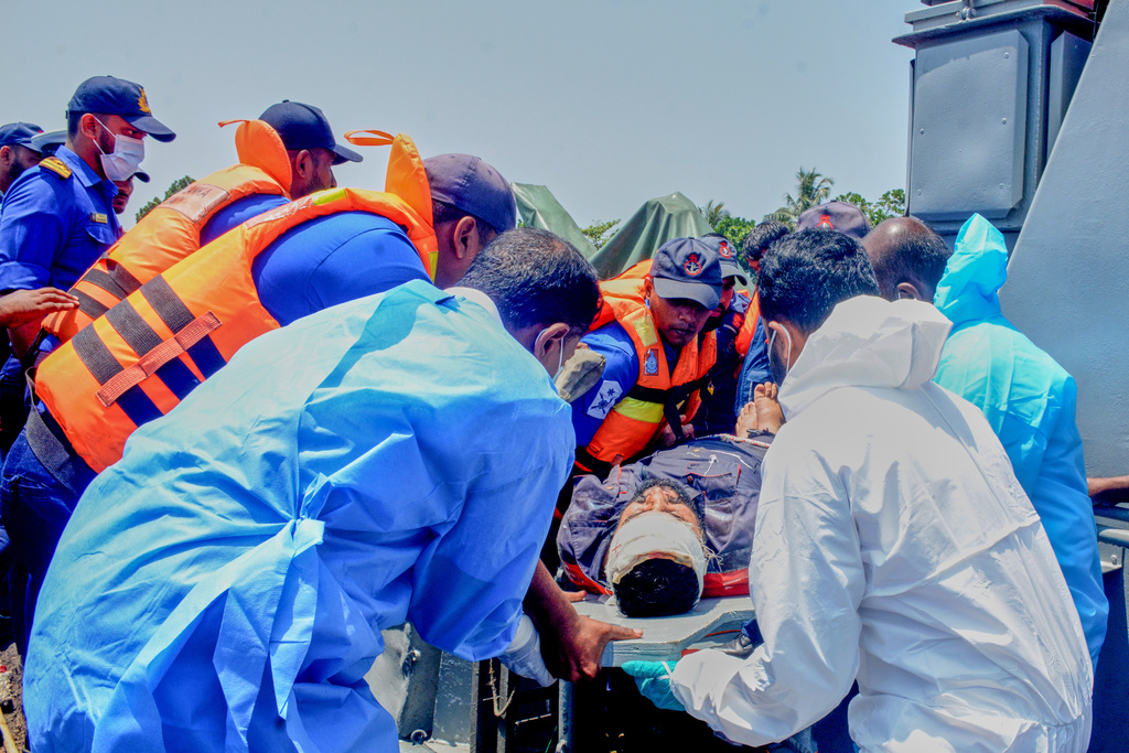 In this photo released by Sri Lankan President Media Division, Sri Lankan Navy sailors take one of the injured Iranian sailors from IRIS Dena warship to hospital after their ship sank outside Sri Lanka's territorial waters, in Galle, Sri Lanka, March 4, 2026. (Sri Lankan Presidential Media Division via AP)