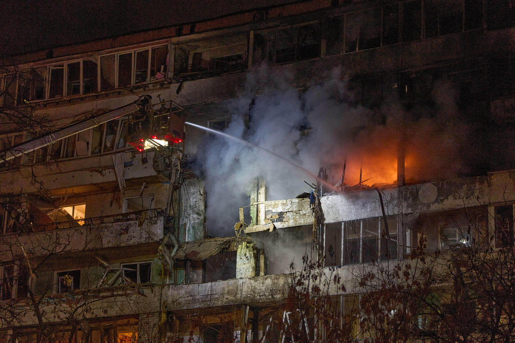 FILE - Firefighters put out the fire after a drone hit a multi-storey residential building during Russia's night drone attack in Kyiv, Ukraine, Nov. 25, 2025. (AP Photo/Efrem Lukatsky, file)