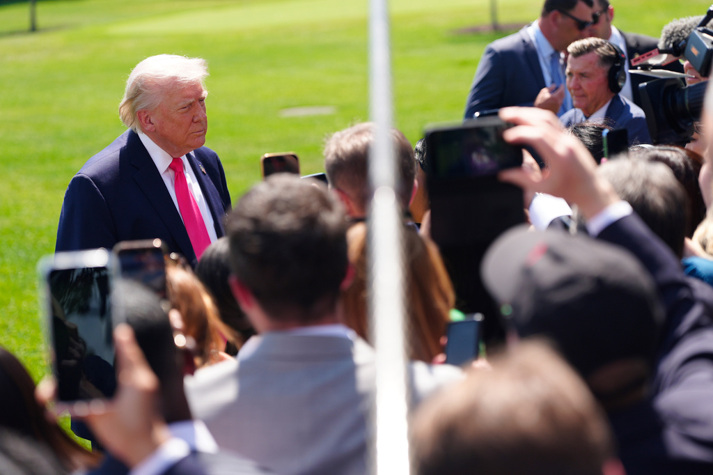 President Donald Trump speaks with reporters before departing on Marine One from the South Lawn of the White House, Thursday, April 16, 2026, in Washington. (AP Photo/Jen Golbeck)