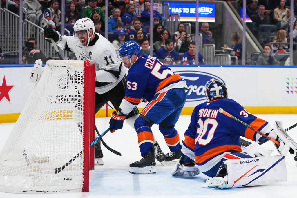 Los Angeles Kings' Anze Kopitar (11) celebrates after scoring a goal during the first period of an NHL hockey game as New York Islanders' Casey Cizikas (53) and goaltender Ilya Sorokin (30) watch Friday, March 13, 2026, at UBS Arena in Elmont, N.Y. (AP Photo/Frank Franklin II)