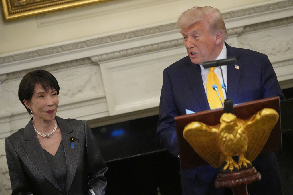 President Donald Trump attends a dinner with Japan's Prime Minister Sanae Takaichi in the State Dining Room of the White House, Thursday, March 19, 2026, in Washington. (AP Photo/Julia Demaree Nikhinson)