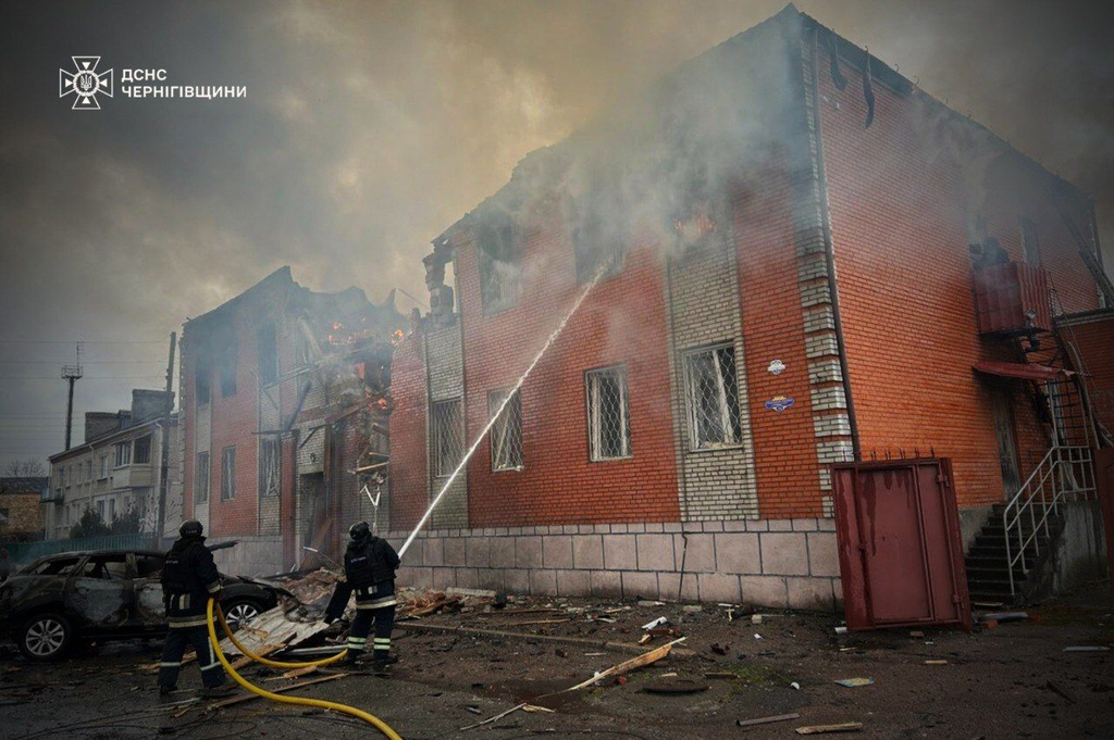 In this photo provided by the Ukrainian Emergency Services on Tuesday, April 7, 2026, rescue workers put out a fire of a building destroyed by a Russian strike on Novhorod-Siverskyi, Chernihiv region, Ukraine. (Ukrainian Emergency Service via AP)