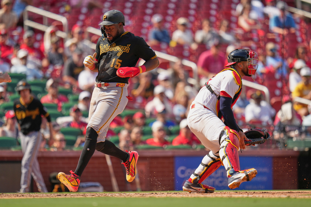 Pittsburgh Pirates' Oneil Cruz (15) scores past St. Louis Cardinals catcher Iván Herrera during the seventh inning of a baseball game Sunday, Aug. 30, 2026, in St. Louis. (AP Photo/Jeff Roberson)