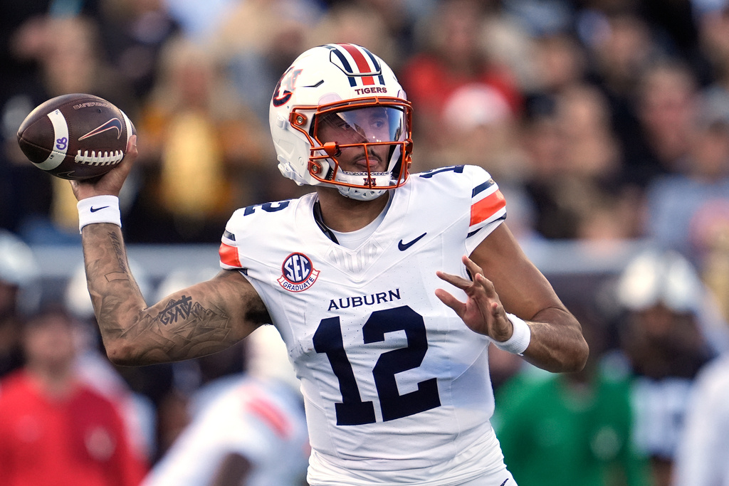 Auburn quarterback Ashton Daniels (12) looks to throw a pass during the first half of an NCAA college football game against Vanderbilt, Saturday, Nov. 8, 2025, in Nashville, Tenn. (AP Photo/George Walker IV)