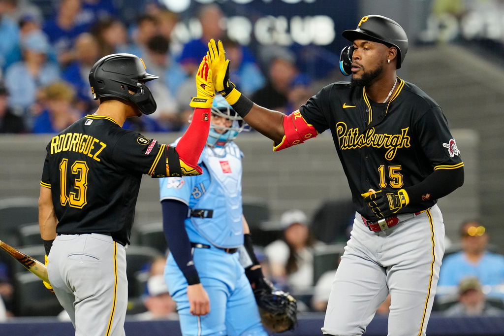 Pittsburgh Pirates Oneil Cruz (15) celebrates his home run with teammate Endy Rodríguez (13) during the econd inning of a baseball game against the Toronto Blue Jays in Toronto on Sunday, May 24, 2026. (Frank Gunn/The Canadian Press via AP)