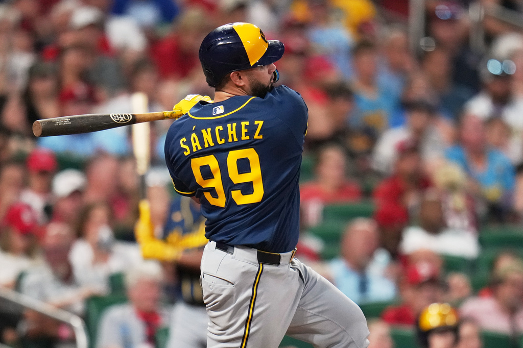 Milwaukee Brewers' Gary Sánchez follows through on a two-run single during the seventh inning in the second game of a baseball doubleheader against the St. Louis Cardinals Tuesday, July 7, 2026, in St. Louis. (AP Photo/Jeff Roberson)