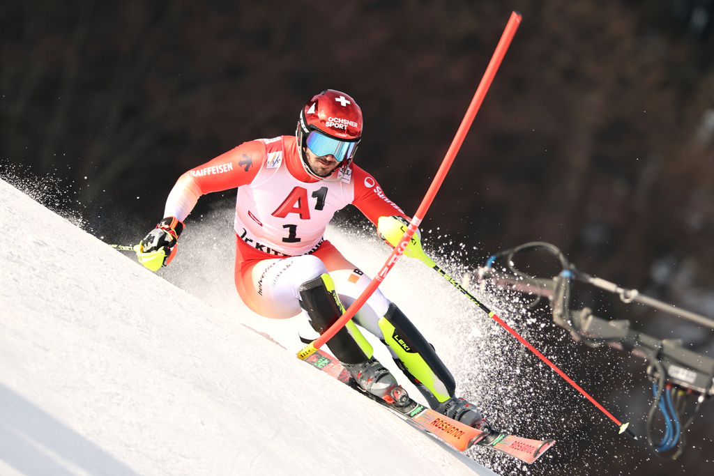 Switzerland's Loic Meillard speeds down the course during an alpine ski, men's World Cup slalom in Kitzbuehel, Austria, Sunday, Jan. 25, 2026. (AP Photo/Marco Trovati)