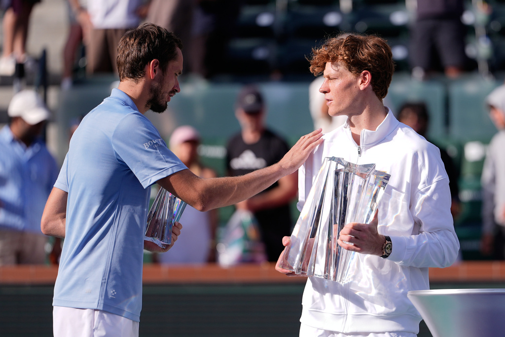 Jannik Sinner, of Italy, right, is congratulated by Daniil Medvedev, of Russia, after Sinner defeated Medvedev during a final match at the BNP Paribas Open tennis tournament, Sunday, March 15, 2026, in Indian Wells, Calif. (AP Photo/Mark J. Terrill)