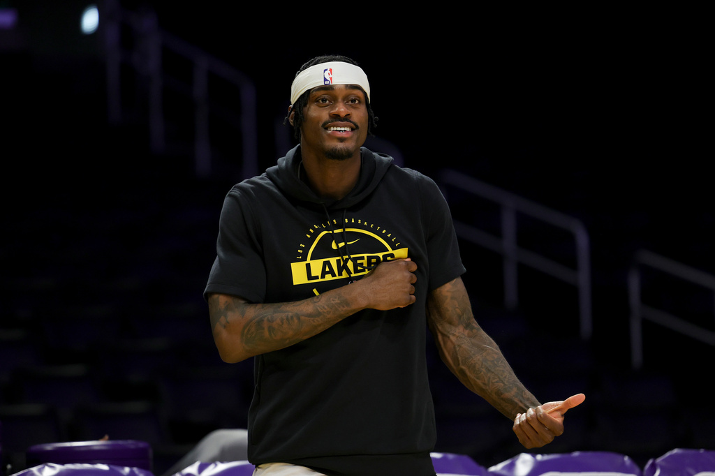 Los Angeles Lakers forward Jarred Vanderbilt reacts while walking on the court before an NBA basketball game against the Washington Wizards, Monday, March 30, 2026, in Los Angeles. (AP Photo/Ryan Sun)