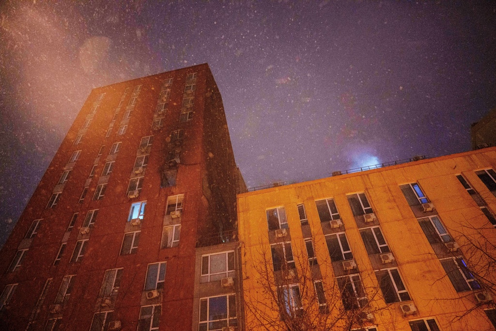 A residential building is seen damaged by a Russian strike on Kyiv, Ukraine, on Friday, Jan. 9, 2026. (AP Photo/Evgeniy Maloletka)