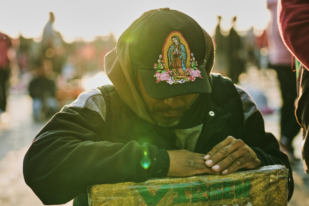 A man prays outside the Basilica of Our Lady of Guadalupe in Mexico City, on her feast day, Friday, Dec. 12, 2025. (AP Photo/Claudia Rosel)