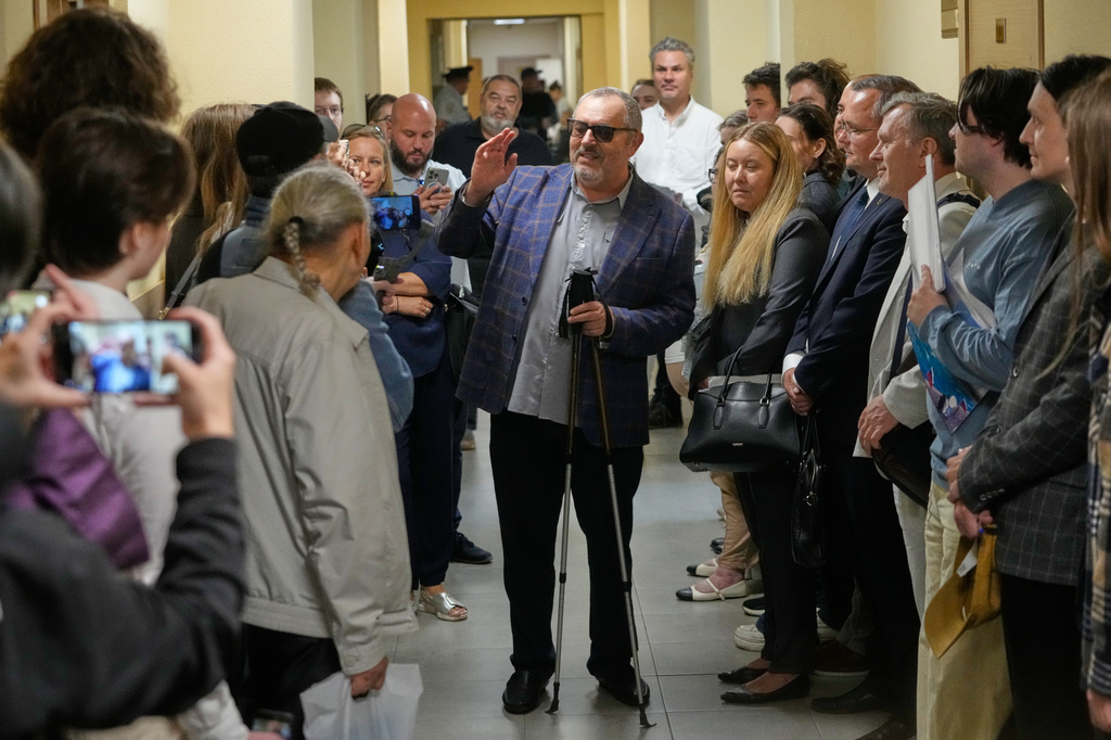 Russian politician Boris Nadezhdin, accused of displaying "extremist symbols," speaks to journalists as he arrives at the courtroom in the town of Dolgoprudny outside Moscow, Russia, Friday, July 17, 2026. (AP Photo/Pavel Bednyakov)