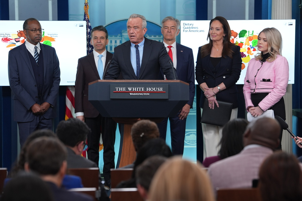 Human Services Secretary Robert F. Kennedy Jr. speaks during a press briefing with from left, Dr. Ben Carson, National Nutrition Advisor at U.S. Department of Agriculture, Dr. Marty Makary, Food and Drug Administration (FDA) commissioner, Dr. Mehmet Oz, administrator of the Centers for Medicare & Medicaid Services, Agriculture Secretary Brooke Rollins, and White House Press Secretary Karoline Leavitt, at the White House, Wednesday, Jan. 7, 2026, in Washington. (AP Photo/Evan Vucci)