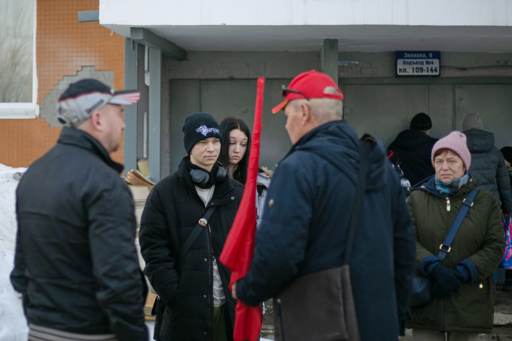 People gather at the site of a planned protest of restrictions on Telegram after authorization for the rally was revoked due to a "potential emergency situation" in Perm, Russia, on March 15, 2026. (AP Photo)