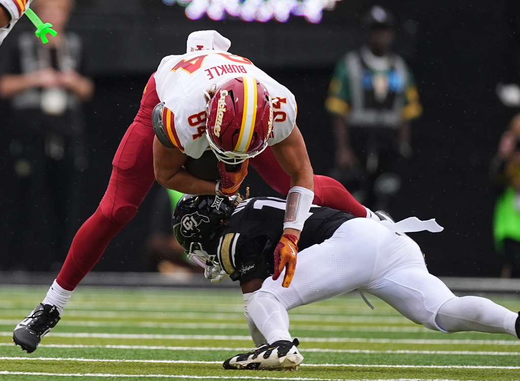 Iowa State tight end Gabe Burkle, top, is stopped, after catching a pass for a short gain, by Colorado defensive back Makari Vickers in the first half of an NCAA college football game Saturday, Oct. 11, 2025, in Boulder, Colo. (AP Photo/David Zalubowski)