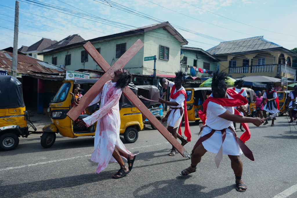 Members of the St Francis Catholic Church take part in a Way of the Cross re-enactment of the crucifixion of Jesus Christ on Good Friday during Holy Week in Lagos, Nigeria, Friday, April 3, 2026. (AP Photo/Sunday Alamba)