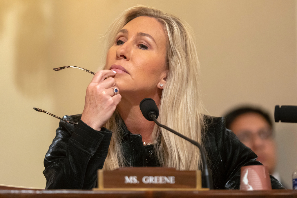 Rep. Marjorie Taylor Greene, R-Ga., listens during a hearing of the House Committee on Homeland Security on Capitol Hill in Washington, Thursday, Dec. 11, 2025. (AP Photo/Mark Schiefelbein)