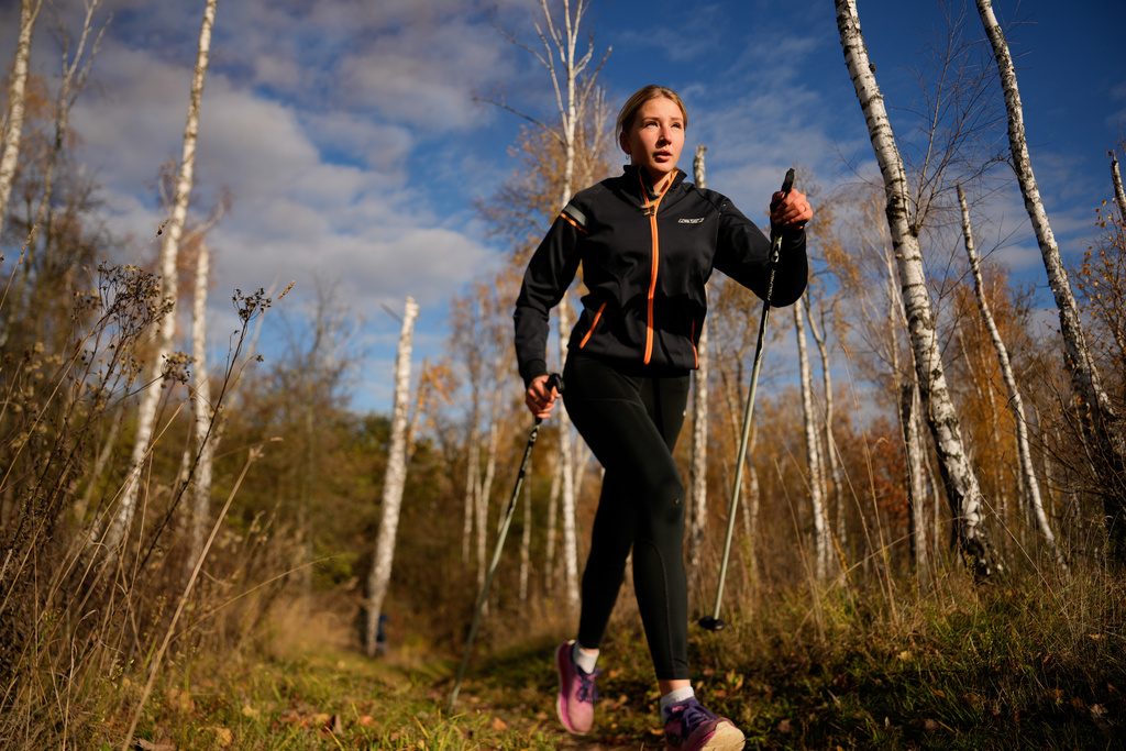 Biathlete Yekateryna Mashtalier, 18, runs during a training session at the ski base in Chernihiv, Ukraine, Thursday, Oct. 30, 2025. (AP Photo/Julia Demaree Nikhinson)