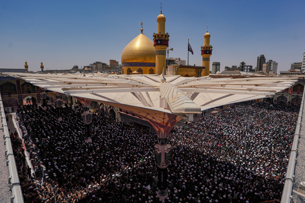 Mourners gather in prayer during the funeral procession for the late Iranian Supreme Leader Ayatollah Ali Khamenei inside the Imam Ali Shrine in Najaf, Iraq, Wednesday, July 8, 2026. (AP Photo/Anmar Khalil)