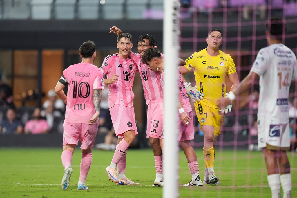 Inter Miami midfielder Telasco Segovia (8) celebrates with teammates after scoring his side's second goal past Atletico de San Luis goalkeeper Andres Sanchez (1) during the first half of a Leagues Cup soccer match, Wednesday, Aug. 5, 2026, in Miami. (AP Photo/Rebecca Blackwell)
