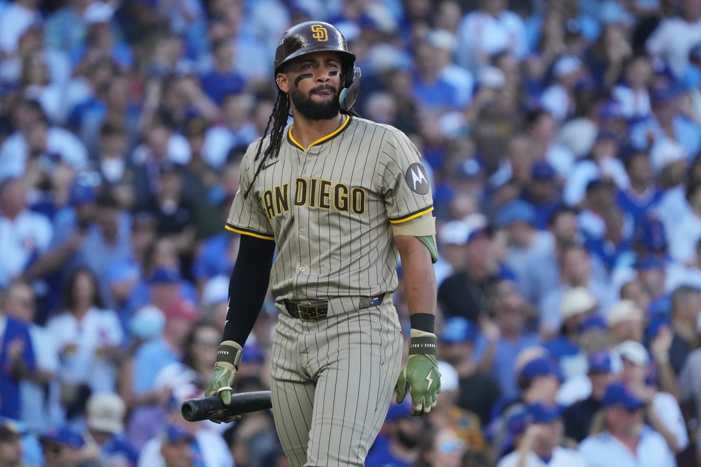 San Diego Padres' Fernando Tatis Jr. reacts after striking out during the eighth inning of Game 1 of a National League wild card baseball game Tuesday, Sept. 30, 2025, in Chicago. (AP Photo/Nam Huh)