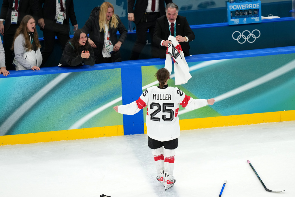Alina Muller (25) celebrates after scoring the winning goal in overtime to beat Sweden in the women's ice hockey bronze medal game at the 2026 Winter Olympics, in Milan, Italy, Thursday, Feb. 19, 2026. (AP Photo/Carolyn Kaster)