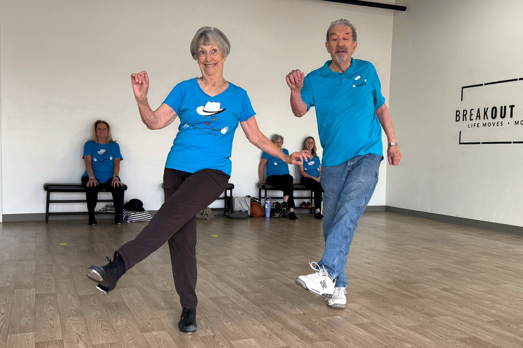 The Rodeo City Wreckettes' Carol Ross 87, and her husband, John, 89, perform a dance to the song, “Let’s Chase Each Other ‘round the Room Tonight" on Thursday, April 16, 2026, in Tucson, Ariz. (Anita Snow via AP)