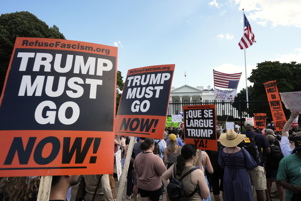Activists protest President Donald Trump's federal takeover of policing of the District of Columbia, Saturday, Aug. 16, 2025, near the White House in Washington. (AP Photo/Alex Brandon)