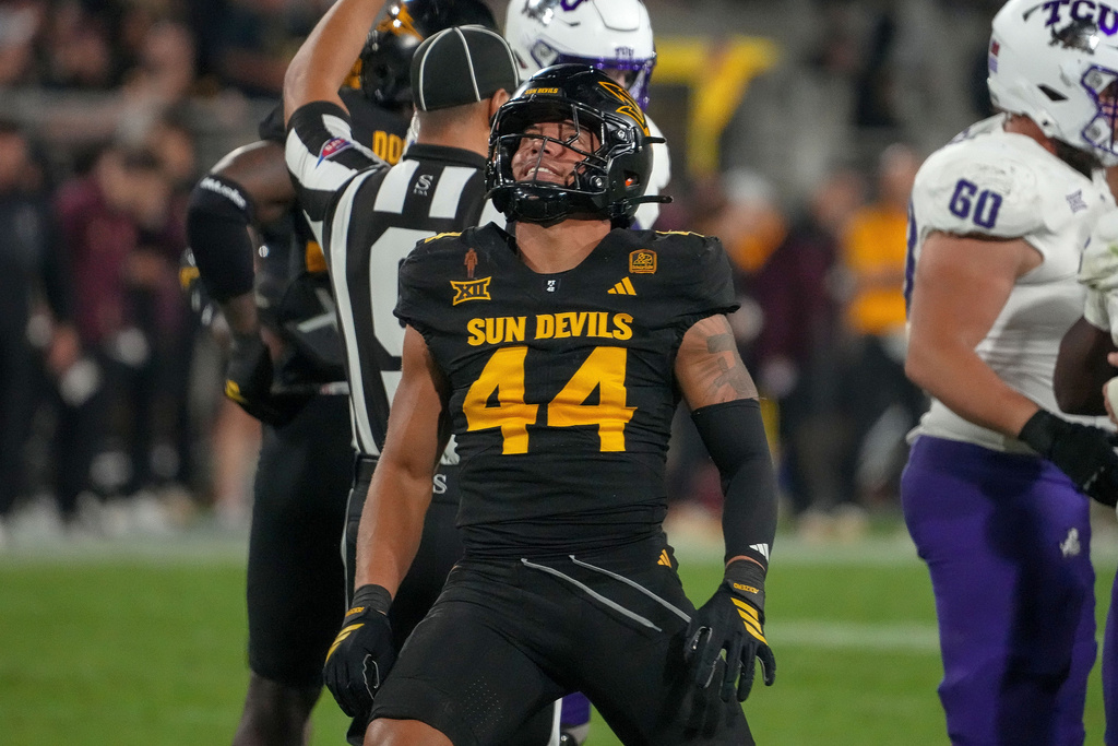 Arizona State Sun Devils linebacker Keyshaun Elliott (44) celebrates a third down stop against the TCU Horned Frogs during the first half of an NCAA college football game Friday, Sept. 26, 2025, in Tempe, Ariz. (AP Photo/Darryl Webb)