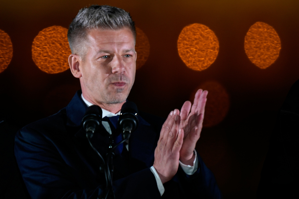 Peter Magyar, the leader of the opposition Tisza party applauds after claiming victory in a parliamentary election in Budapest, Hungary, Sunday, April 12, 2026. (AP Photo/Darko Bandic)