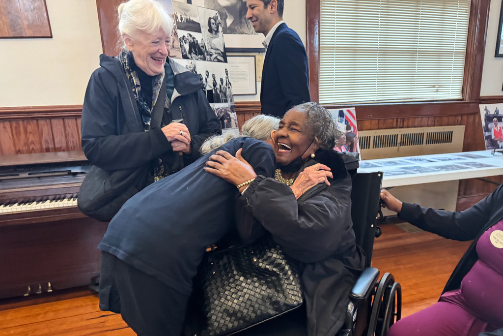 Doris Wilson, a foot soldier who marched from Selma to Montgomery in 1965, sitting, is reunited with Dr. June Finer, the doctor who tended to her throughout the march, in Marion, Ala., Dec. 4, 2025. (AP Photo/Safiyah Riddle)