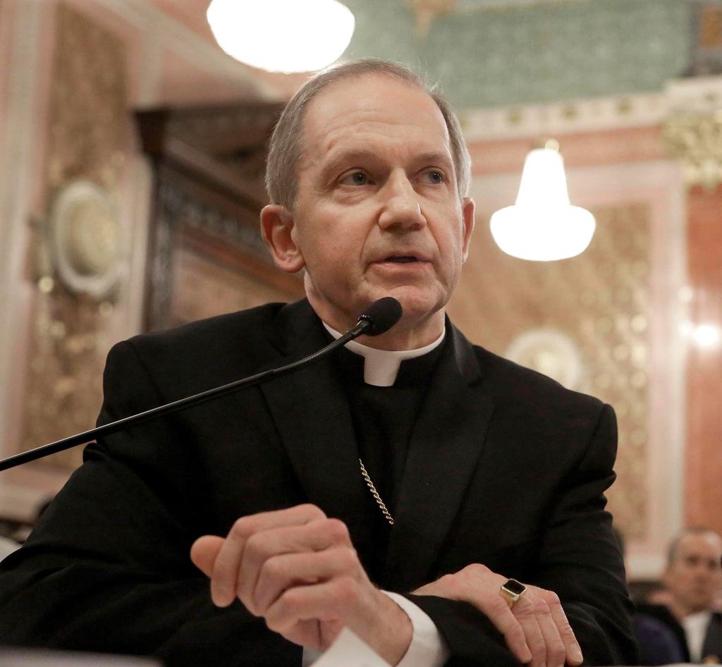 FILE - Bishop Thomas Paprocki, of the Springfield Catholic diocese, testifies during a Senate Executive committee hearing at the Illinois State Capitol in Springfield, Ill., Jan. 3, 2013. (AP Photo/Seth Perlman, File)