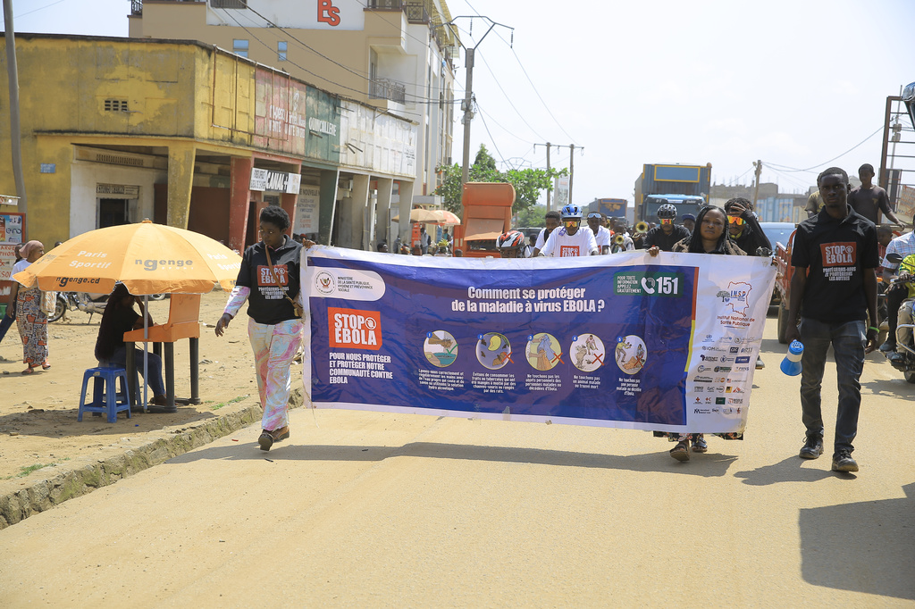 Residents and frontline workers embark on Ebola outbreak awareness campaign in Beni, North Kivu province, eastern Congo, Friday, Aug. 21, 2026. (AP Photo/Sebastien Kitsa Musayi)