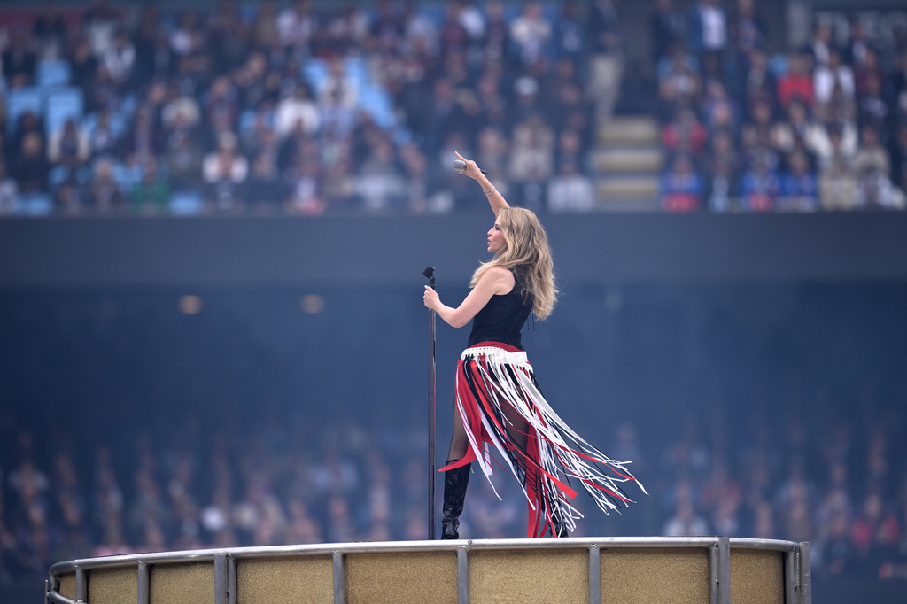 Singer Kylie Minogue performs before the start of the Australian Football League grand final between the Brisbane Lions and the Fremantle Dockers in Melbourne, Australia Saturday, Sept. 26, 2026. (Joel Carrett/AAP Image via AP)