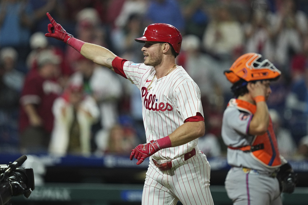 Philadelphia Phillies' Max Kepler celebrates after hitting a home run off of New York Mets pitcher Ryan Helsley during the eighth inning of a baseball game, Wednesday, Sept. 10, 2025, in Philadelphia. (AP Photo/Matt Rourke)