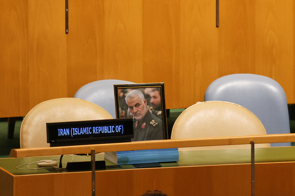 A photo of the late Qasem Soleimani is displayed as chairs for delegates from Iran are unoccupied while Israeli Prime Minister Benjamin Netanyahu speaks during the 81st session of the United Nations General Assembly at United Nations headquarters, Thursday, Sept. 24, 2026. (AP Photo/Heather Khalifa) ADDS ID