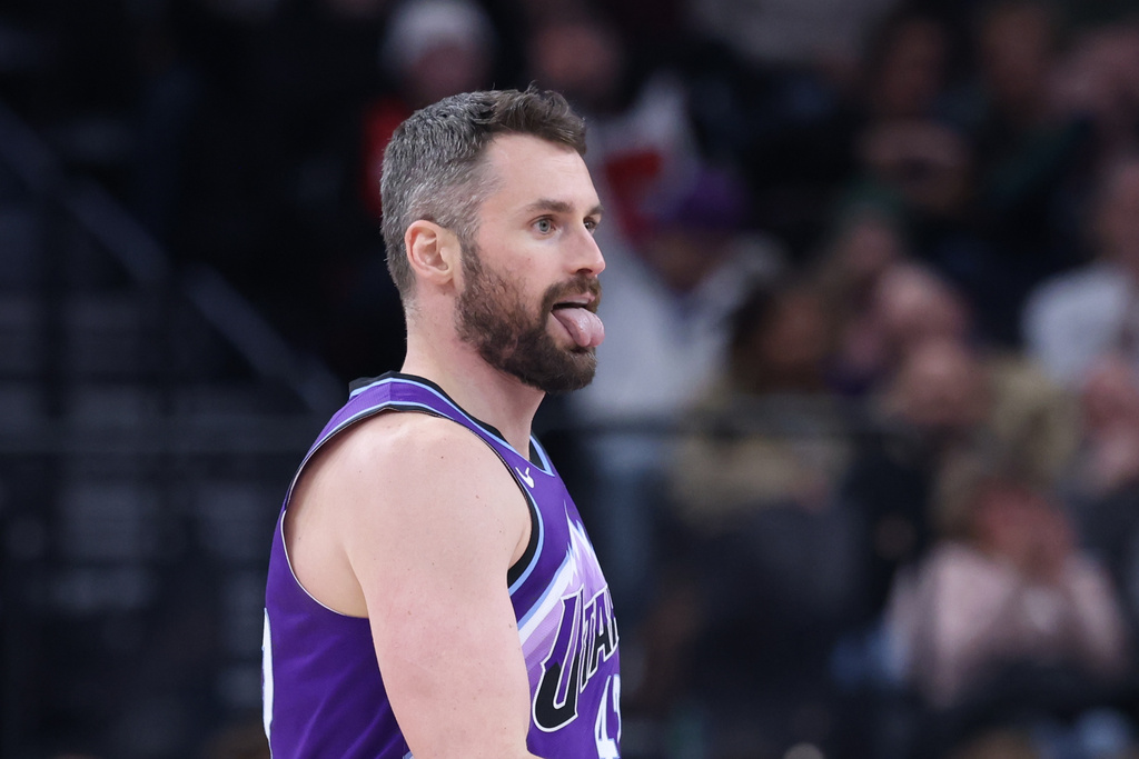 Utah Jazz forward Kevin Love reacts after a shot against the Houston Rockets during the second half of an NBA basketball game Monday, Dec. 1, 2025, in Salt Lake City. (AP Photo/Rob Gray)