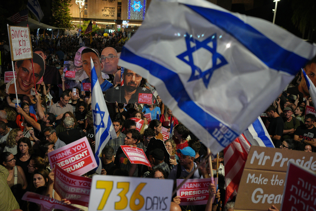 People take part in a rally in support of hostages kidnapped by Hamas, at a plaza known as hostages square, in Tel Aviv, Israel, Saturday, Oct. 11, 2025, ahead of the expected release of the hostages held in the Gaza Strip. (AP Photo/Emilio Morenatti)