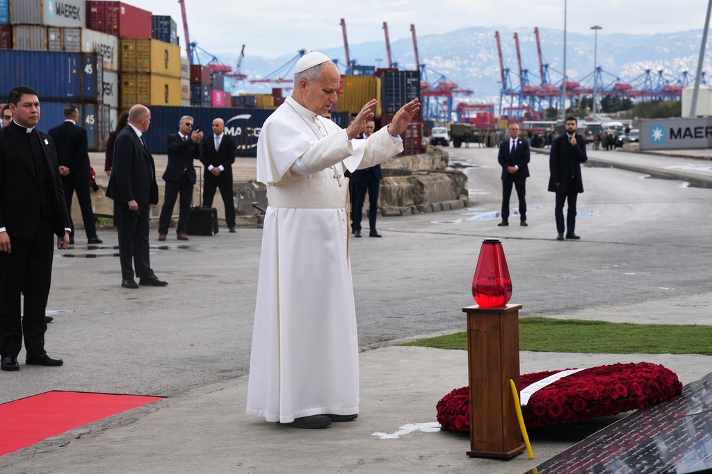 Pope Leo XIV holds a moment of prayer at the site of the 2020 Beirut port explosion in Beirut, Lebanon, Tuesday, Dec. 2, 2025. (AP Photo/Domenico Stinellis)