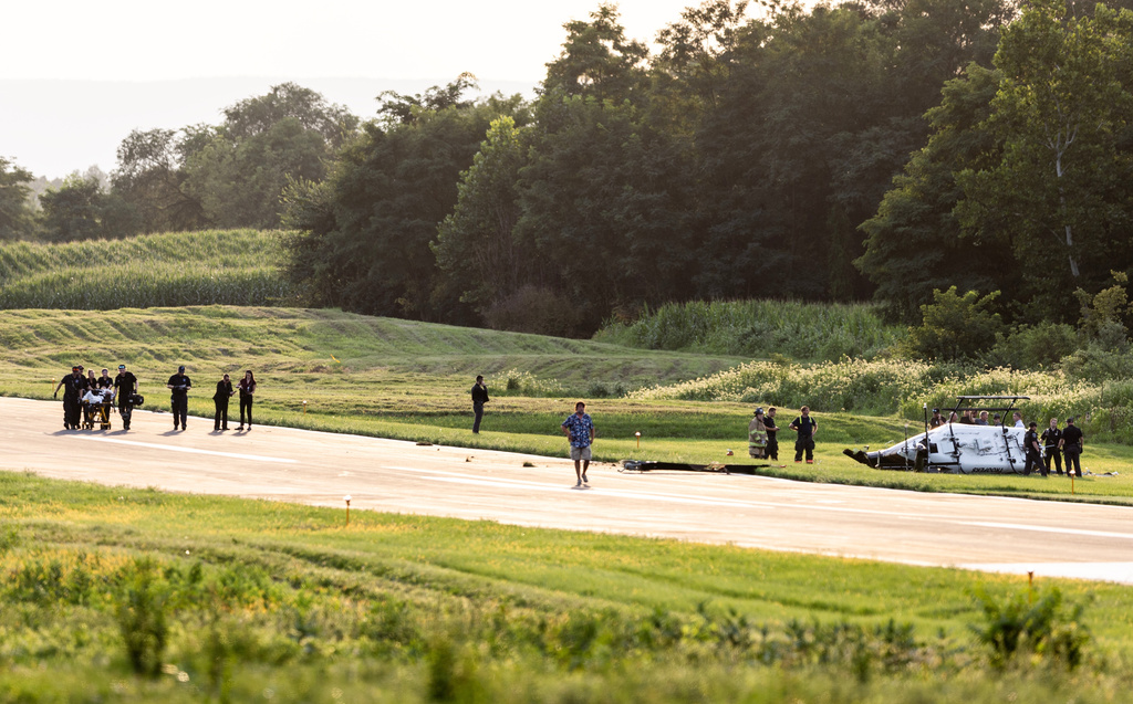 Authorities investigate a crash between a Pennsylvania State Police helicopter and a small plane at the Carlisle airport in Carlisle, Pa. Wednesday, Aug. 19, 2026. (Sean Simmers/The Patriot-News via AP)