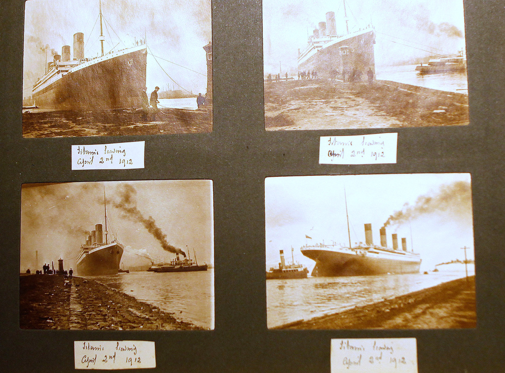 FILE - Photographs of the Titanic are displayed in a family album at the Transport museum in Belfast, Northern Ireland, Tuesday, Oct. 14, 2014. (AP Photo/Peter Morrison, File)