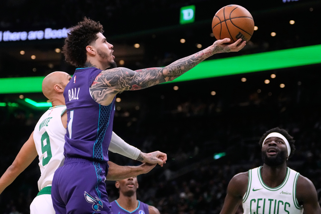Charlotte Hornets guard LaMelo Ball (1) drives to the basket against the Boston Celtics during the first half of an NBA basketballl game, Wednesday, March 4, 2026, in Boston. (AP Photo/Charles Krupa)