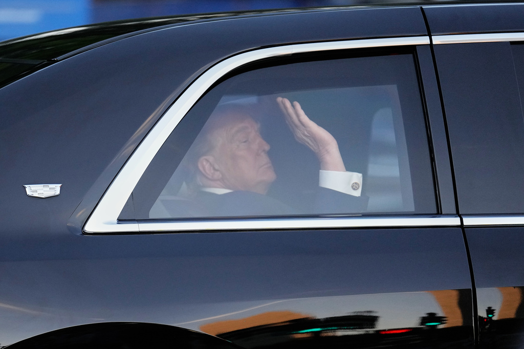 President Donald Trump waves from his motorcade vehicle as he arrives at the opening of the Great American State Fair on the National Mall, Wednesday, June 24, 2026, in Washington. (AP Photo/Carolyn Kaster)